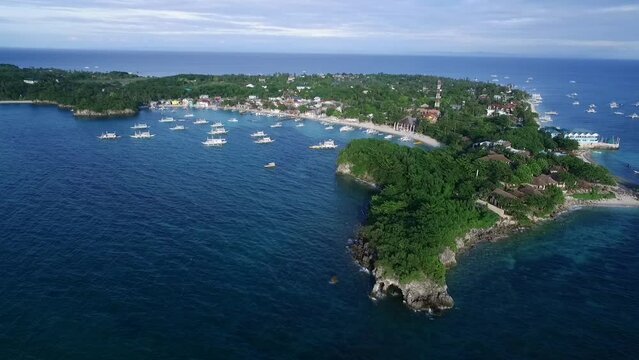 Logon Beach and Boats in Malapascua Island Seashore in Cebu, Philippines. Sulu Sea, Boats and Beautiful Seascape in Background. Drone