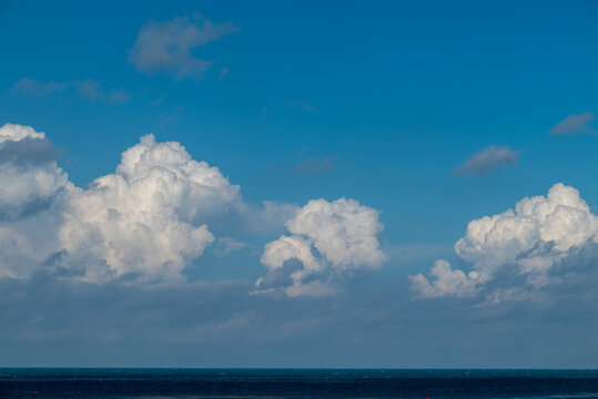 Blue sky, clouds and the sea at Katwijk, The Netherlands.