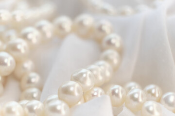 The soft glow of pearls on a white cloth paints a picture of gentle elegance. It's a nostalgic...