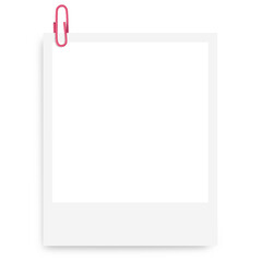 white Polaroid photo frame with a pink paper clip on a blank background.