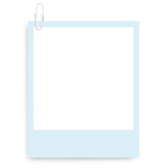 Colored Polaroid photo frame with a colored paper clip on a blank background.