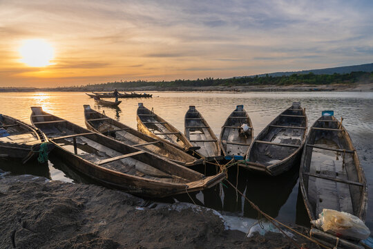 Landscape view of wooden boats on river bank at sunset, Jaflong, Bangladesh