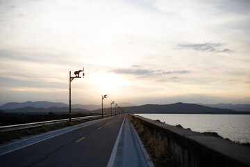 Empty Asphalt Road And Mountain Scenery At Sunset