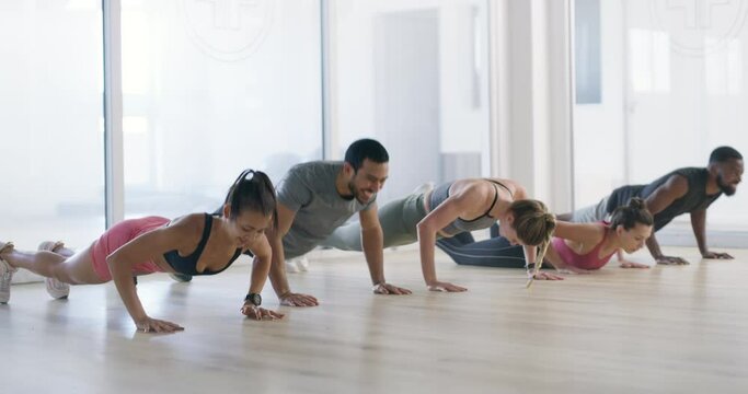 Push ups, running or group of people in gym for fitness workout, body exercise or healthy wellness. Diversity, teamwork or sports athletes in club together for training, aerobics or cardio for energy