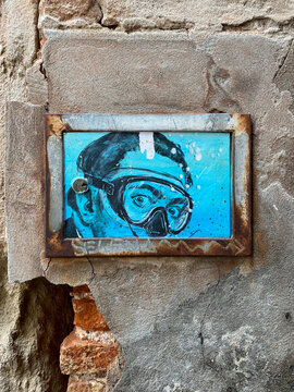 VENICE, ITALY - JANUARY 29, 2020: Street art 'Dali' by Blub. Reinterpretation of 'Self-Portrait' by Salvador Dali. Blub is an anonymous street artist from Florence.