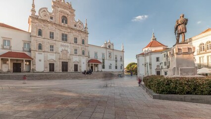 Panorama showing Sa da Bandeira Square with a view of the Santarem See Cathedral aka Nossa Senhora da Conceicao Church timelapse, built in the 17th century Mannerist style. Walking area. Portugal