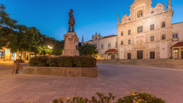 Panorama showing Sa da Bandeira Square with a view of Santarem See Cathedral aka Nossa Senhora da Conceicao Church day to night transition timelapse, built in Mannerist style. Walking area. Portugal