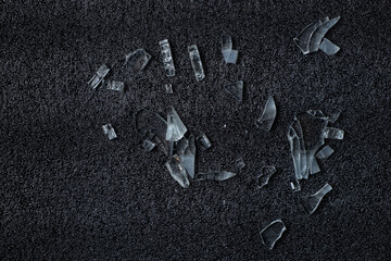Pieces of broken glass on a soft black foam sheet