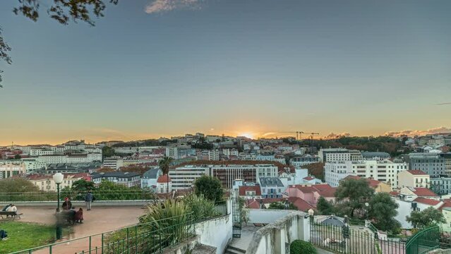 Panorama showing Jardim do Torel timelapse, a traditional garden and viewpoint with unusual views to the city center of Lisbon during sunset. It has a terrace, a bar and a large pond. Portugal