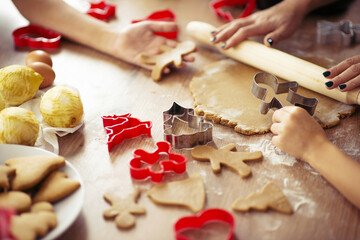 Family with kids cooking ginger bread for Christmas