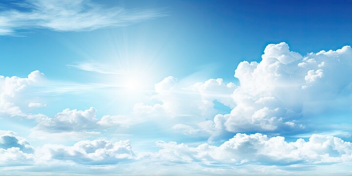 Beauty of summer sky with scattering of fluffy white clouds against backdrop of bright blue. Scene exudes tranquility and making ideal for aim to evoke calm and peaceful atmosphere
