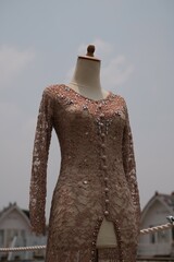 Asian Wedding dress kebaya payet Sundanese Culture with village and lake as a background shot in closed up