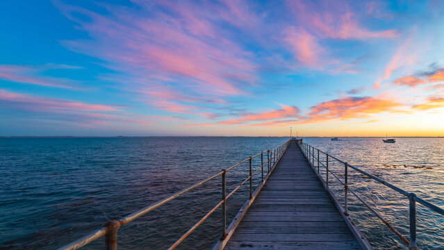 Robe pier with early bird fishermen during sunrise, Limestone Coast, South Australia