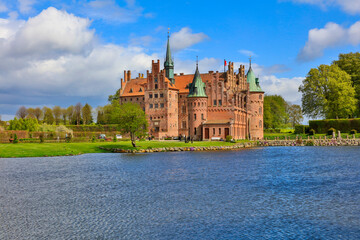 Denmark Egeskov Castle view on a cloudy spring day