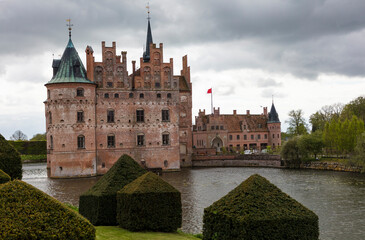 Denmark Egeskov Castle view on a cloudy spring day