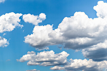 White clouds in a bright blue sky. The beauty of the nature
