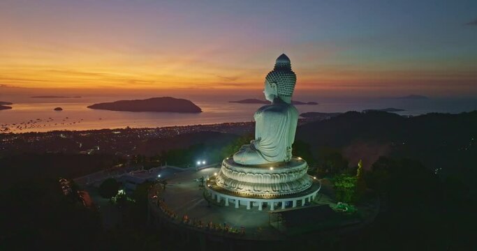 aerial view amazing red light at horizon in twilight at Phuket big Buddha..bright red sky at sunset Gradient color background..Sunset with amazing red color light rays and other atmospheric effects