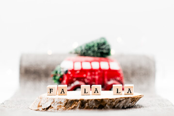 A Christmas setting with ‘Fa la la’ illustrated through wooden cube letters