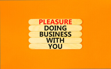 Pleasure doing business with you symbol. Concept words Pleasure doing business with you on wooden stick. Beautiful orange table orange background. Pleasure doing business with you concept. Copy space.