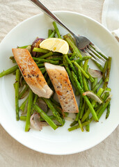 plate of fried tuna fillet with asparagus on the table