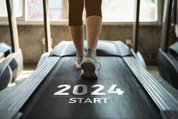 Happy new year 2024,2024 symbolizes the start of the new year. Close up of feet, sportswoman runner...