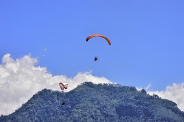 Paragliding is one of the extreme sports of Indonesian society which takes off from the peak of Mount