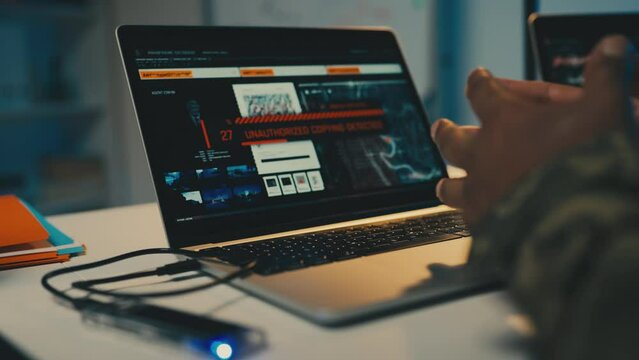 Army officer hacking into military database, copying secret data, espionage