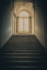 Ancient dark staircase - Grunge interior, nobody, empty building architecture, window.