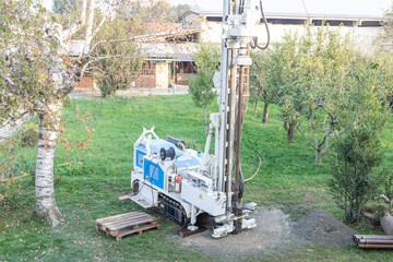 Water well drill. Industrial machinery drilling with mining tower. Engineering equipment.