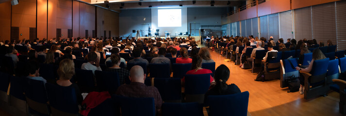 People attending to an European scientific conference.