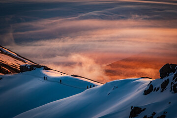 Hikers on the Kilimanjaro crater rim at sunrise © Yann