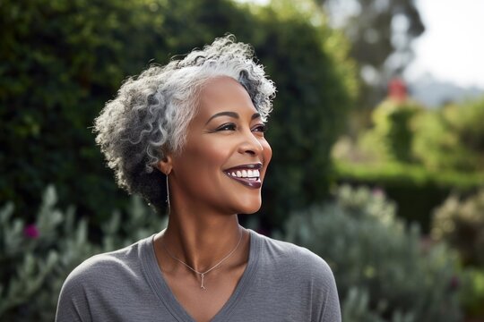 Portrait Close Up Of Smiling Senior African American Woman In A Garden. Family Enjoying Time At Home, Lifestyle Concep