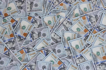 Very big amount of US hundred dollar bills close up. Huge quantity of united states currency notes on flat table