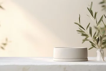 Fotobehang Sophisticated display podium, featuring an olive tree branch and a clean, minimalist design for impactful product showcasing. © Mongkol