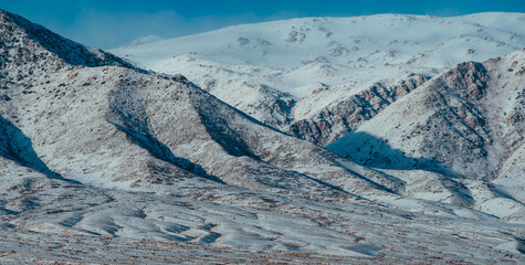 Snow-covered mountain peaks in winter