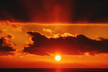 Fiery red sunset over lake