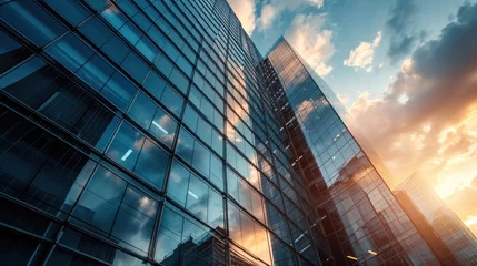 Fotobehang Modern office building or business center. High-rise window buildings made of glass reflect the clouds and the sunset. empty street outside  wall modernity civilization. growing up business © pinkrabbit