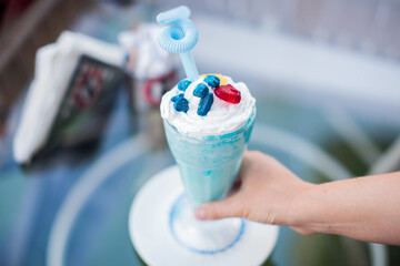 Smoothie on the glass surface of table in cafe