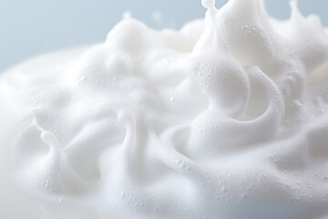 Obraz na płótnie Canvas a close up of a whipped cream with a blue background