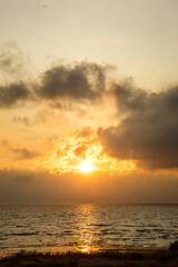 Beautiful sunset near the shore on the sea, background with sunset, orange sunset