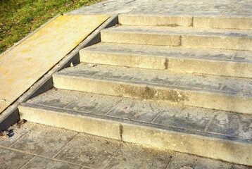 Stairs dirty with sand, thaw after winter with heavy snowfall where sand was constantly sprinkled