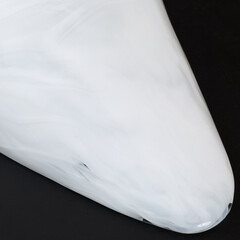 Vintage glass shade wall sconce lamp. Minimalist lighting design. Close-up detail photograph.