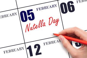 February 5. Hand writing text Nutella Day on calendar date. Save the date.