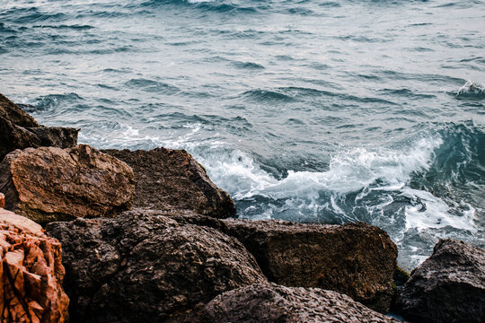 Winter sea with stones on the beach concept photo. Underwater rock. Mediterranean sea.