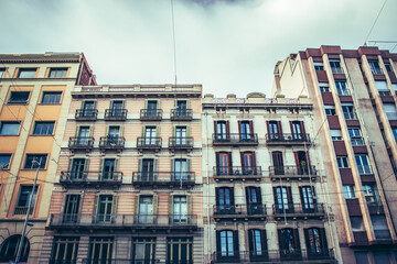 Historical building on Rambla street cityscape image. Bottom street view at sunset time in Barcelona
