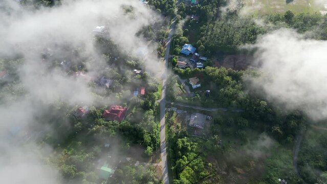 Aerial view of misty morning fog at malays village at Baling, Kedah