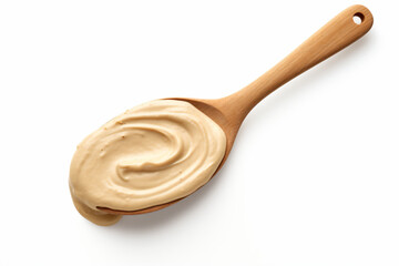 a spoon with a creamy substance on it