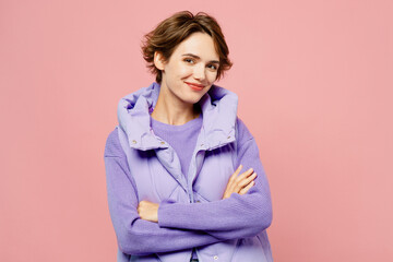 Young smiling happy cool woman she wear purple vest sweatshirt casual clothes hold hands crossed...