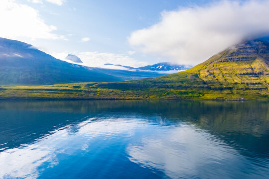 Beautiful Green Landscape and Blue Ocean of Seydisfjordur, Iceland cpatured during early morning