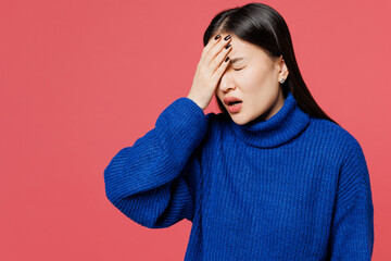 Young sad woman of Asian ethnicity she wearing blue sweater casual clothes put hand on face...
